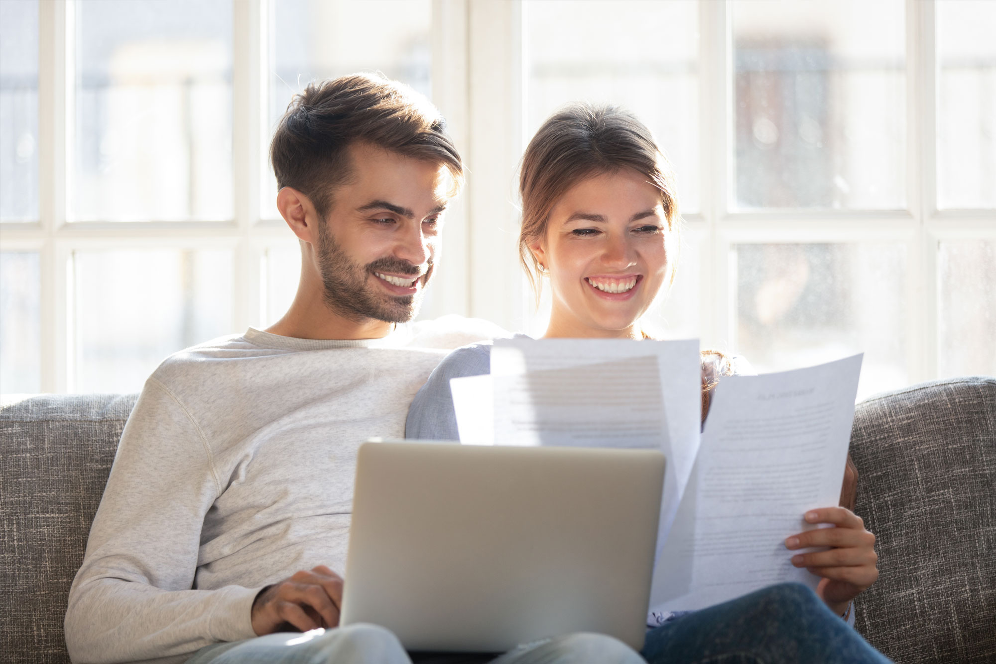 Happy Couple Looking at paperwork
